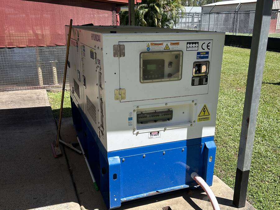 Enclosed standby generator on an outdoor concrete pad
