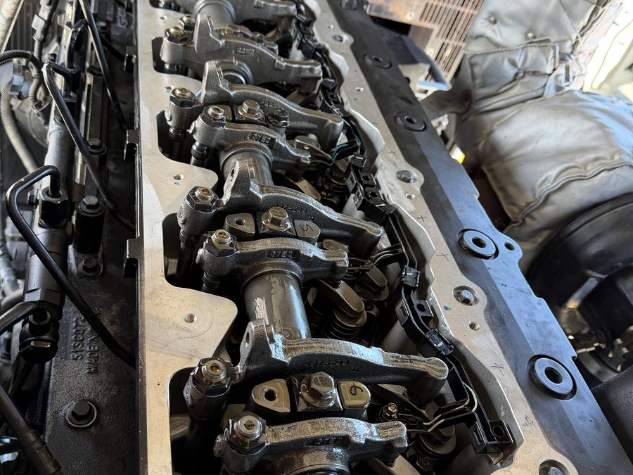 Rocker gear and valve train exposed on a diesel engine during a valve set