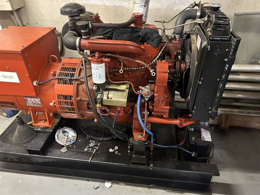 Generator engine and alternator on the skid during a workshop rebuild